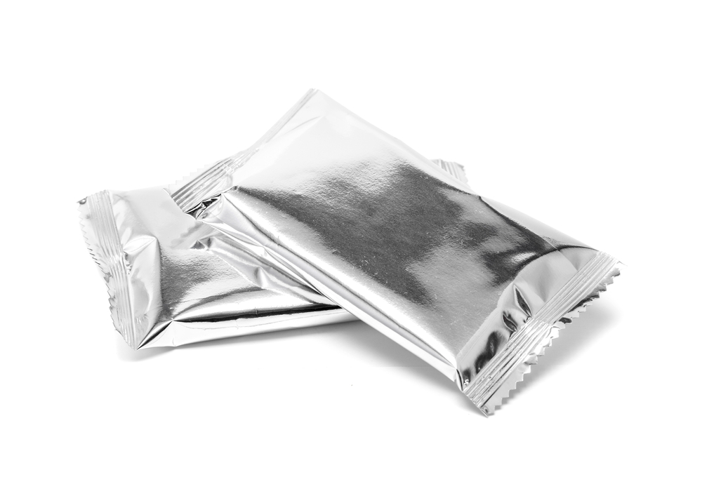 Blank foil sachet formed packaging or four-sided seal pouch on white background